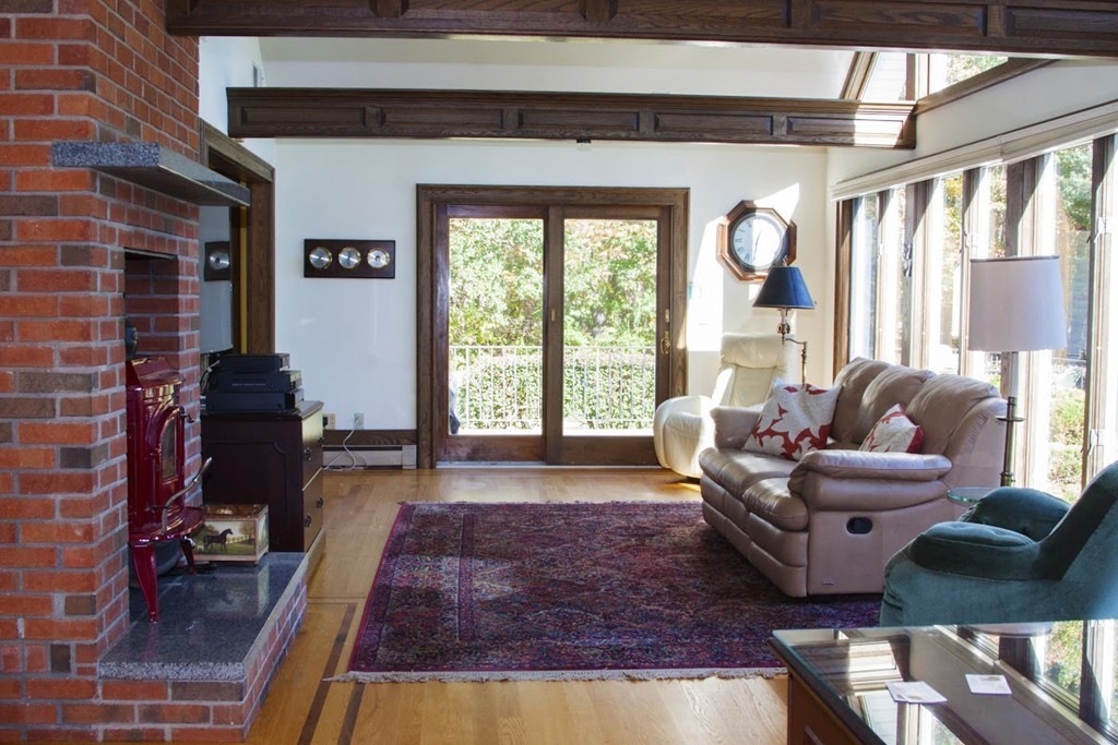 1170 Florence Road Northampton, MA 01062 - Photo 11 of 25 a living room with furniture fireplace and a large window