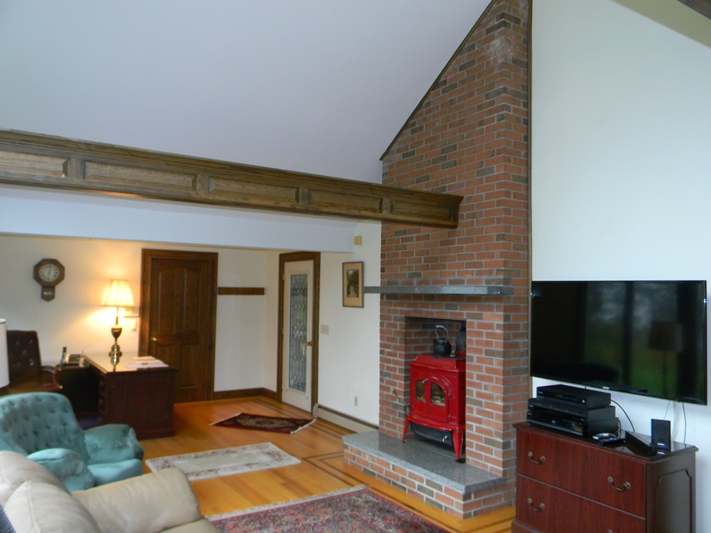 1170 Florence Road Northampton, MA 01062 - Photo 12 of 25 a living room with furniture and a flat screen tv