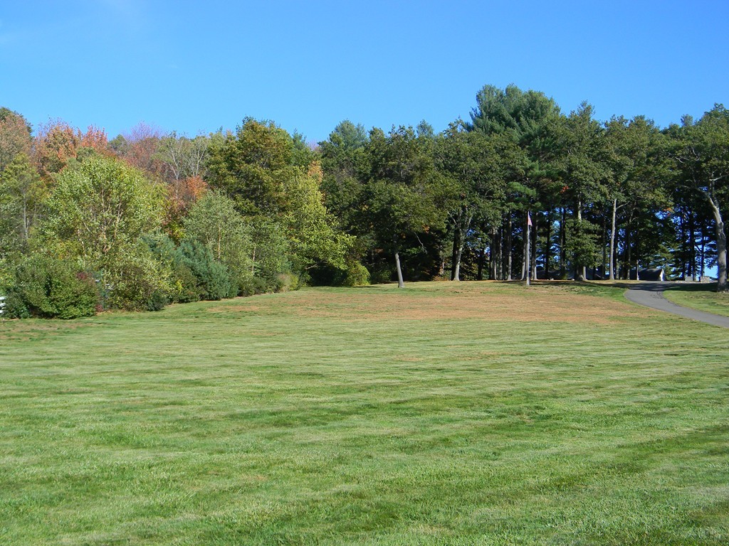 1170 Florence Road Northampton, MA 01062 - Photo 7 of 25 a swimming pool that has lawn chairs with wooden fence