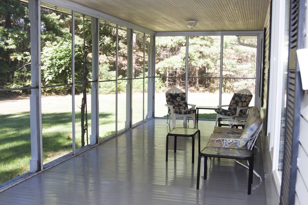 1170 Florence Road Northampton, MA 01062 - Photo 9 of 25 a dining room with furniture water view and a floor to ceiling window