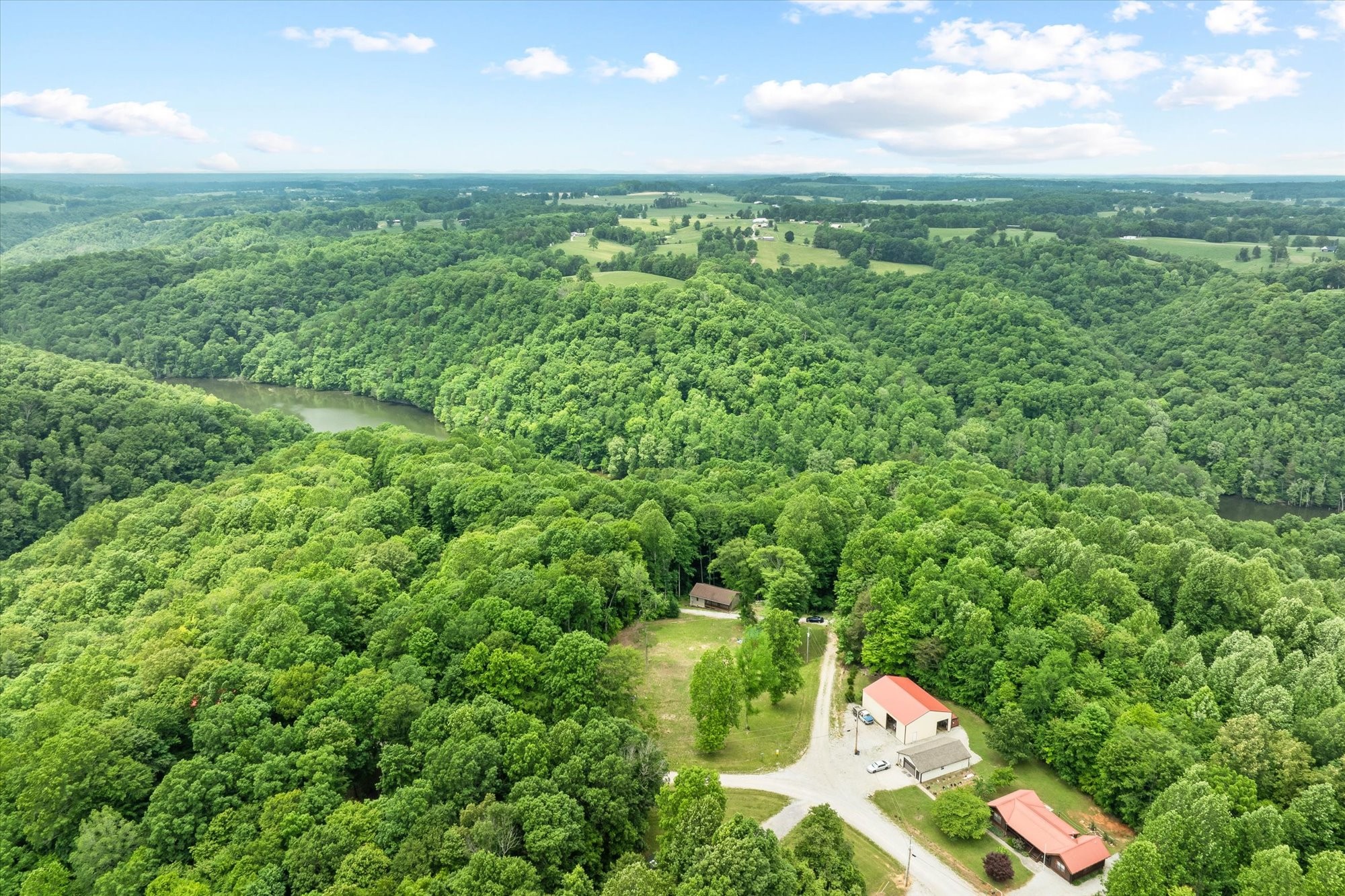 1103 Boles Beaty Road Alpine, TN 38543 - Photo 1 of 24 a view of a city and lush green forest