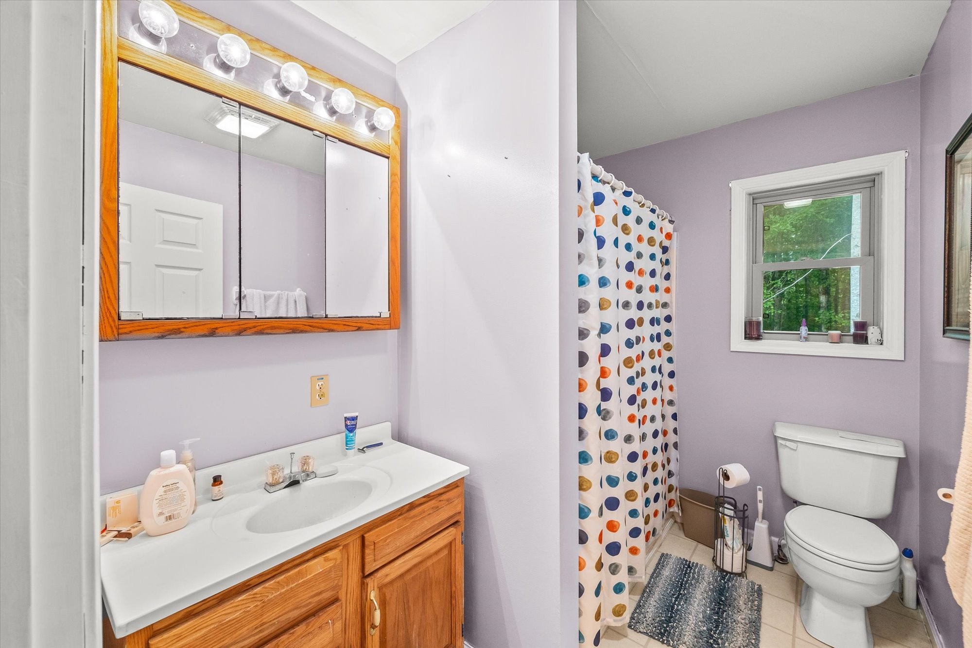 1103 Boles Beaty Road Alpine, TN 38543 - Photo 13 of 24 a bathroom with a sink a toilet and a mirror