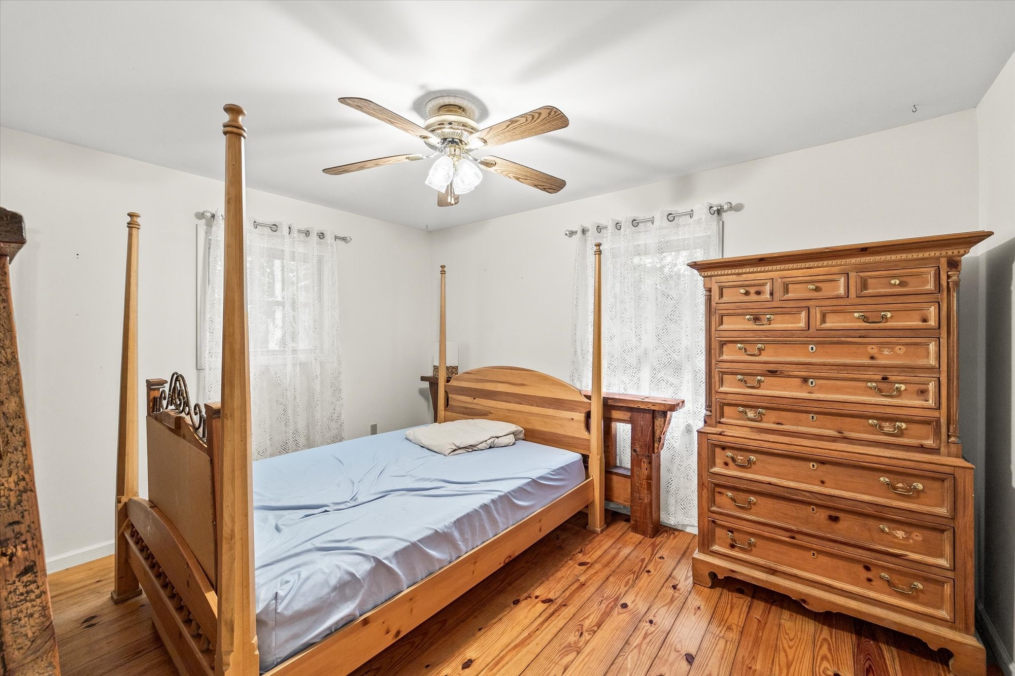 1103 Boles Beaty Road Alpine, TN 38543 - Photo 14 of 24 a bedroom with a bed and a chandelier