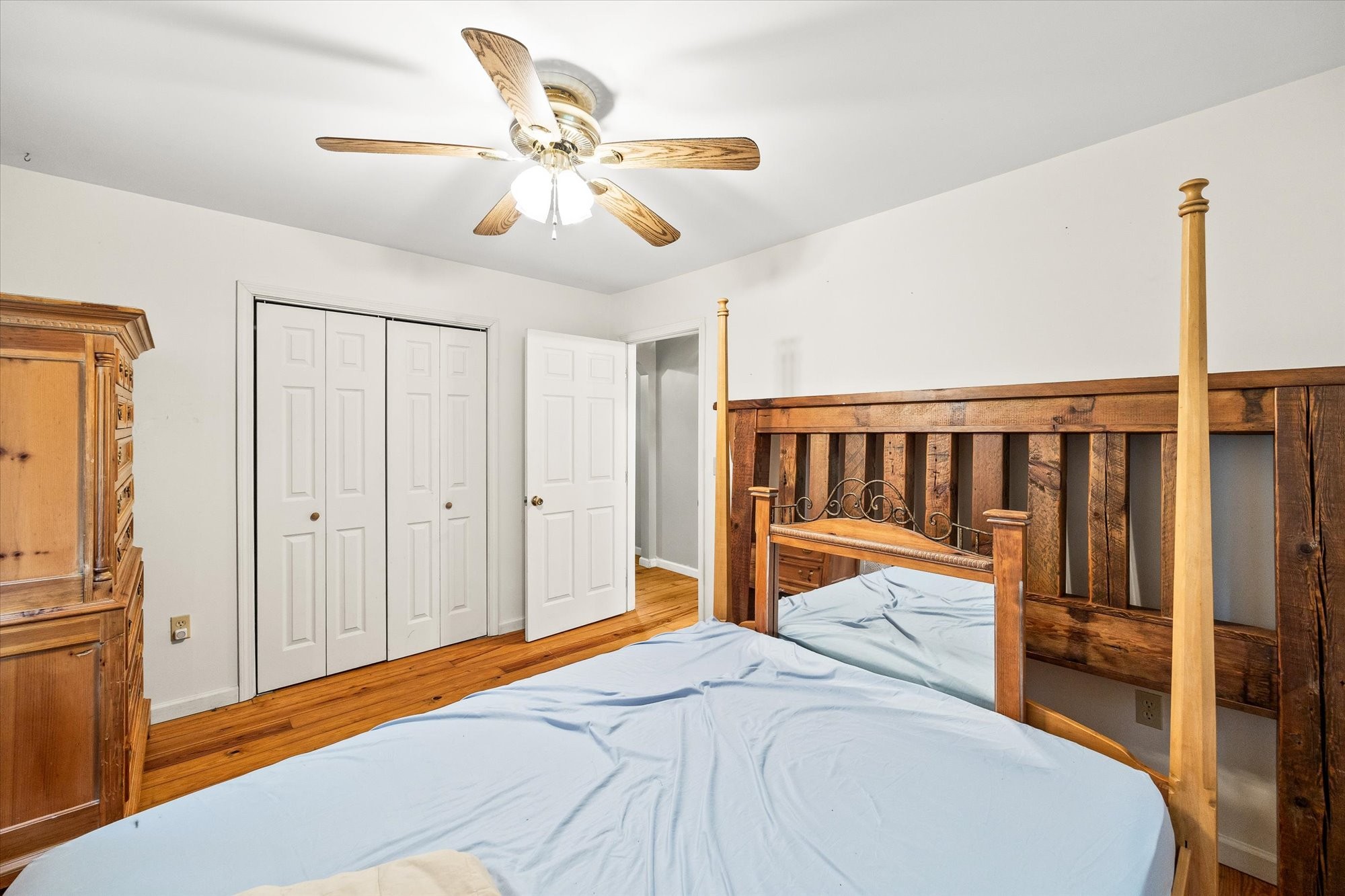 1103 Boles Beaty Road Alpine, TN 38543 - Photo 15 of 24 a bedroom with a bed and wooden floor
