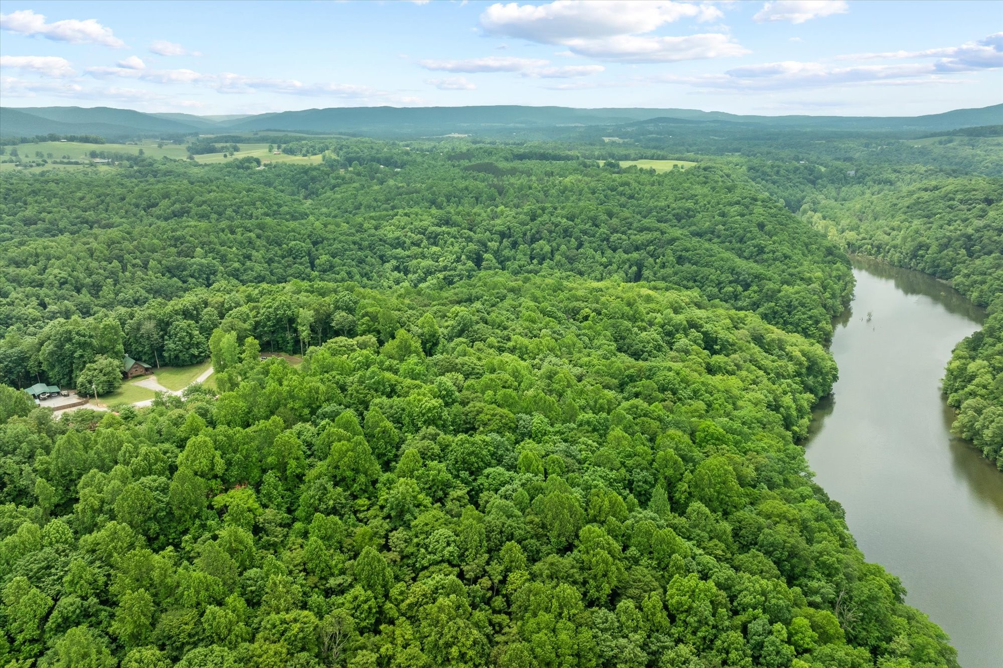1103 Boles Beaty Road Alpine, TN 38543 - Photo 21 of 24 a view of a lush green space with sea