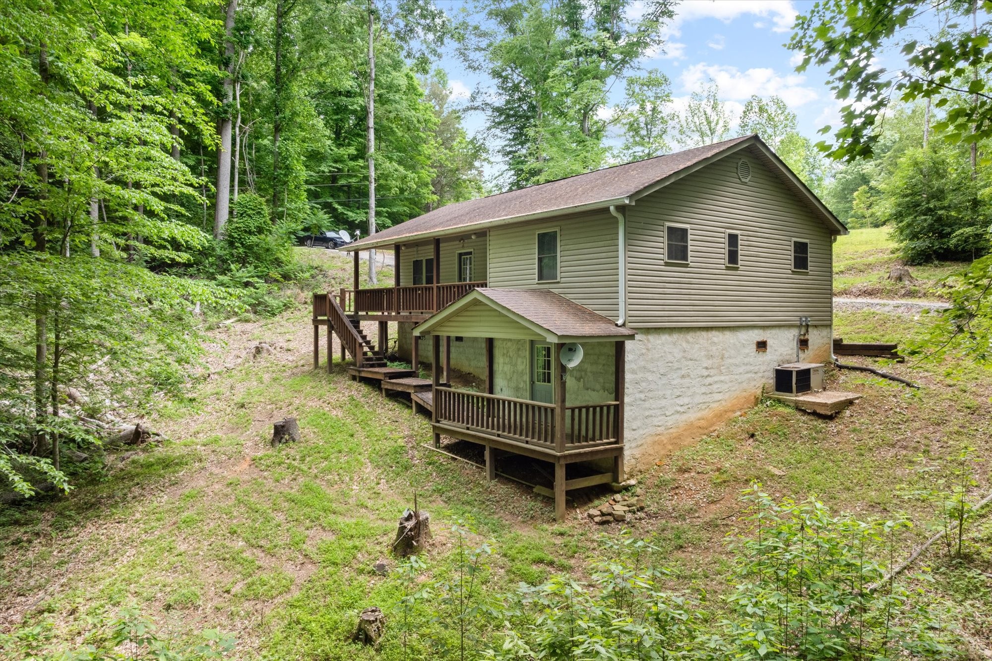 1103 Boles Beaty Road Alpine, TN 38543 - Photo 4 of 24 a view of a house with a yard and fence