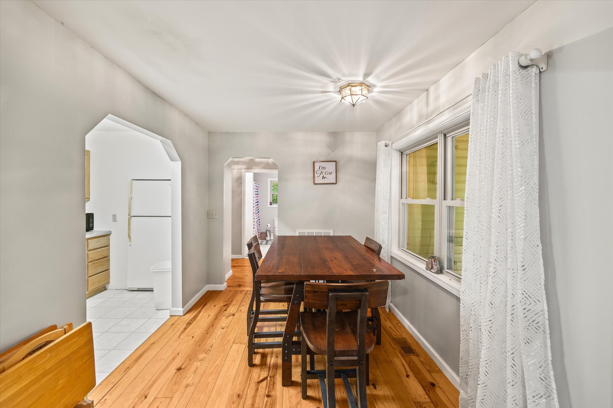 1103 Boles Beaty Road Alpine, TN 38543 - Photo 6 of 24 a view of a dining room with furniture window and wooden floor