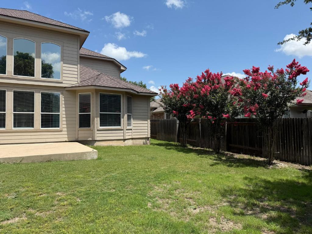 19413 Bridie Path Pflugerville, TX 78660 - Photo 12 of 26 a view of a house with a yard and pathway