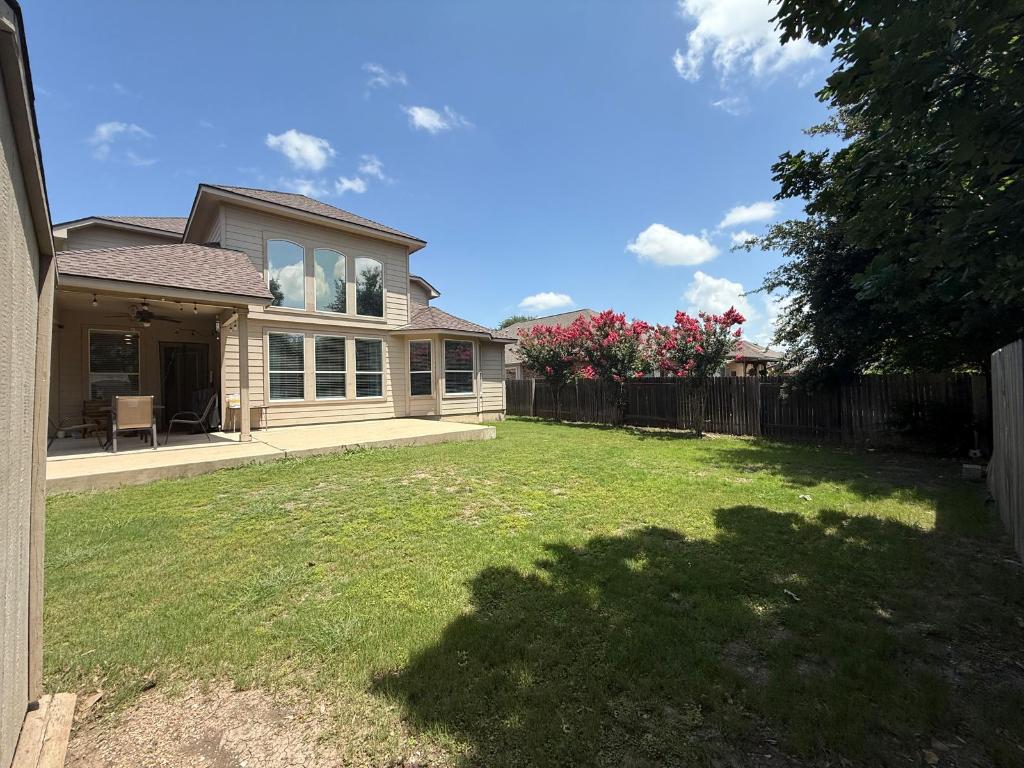 19413 Bridie Path Pflugerville, TX 78660 - Photo 13 of 26 a front view of house with yard and green space
