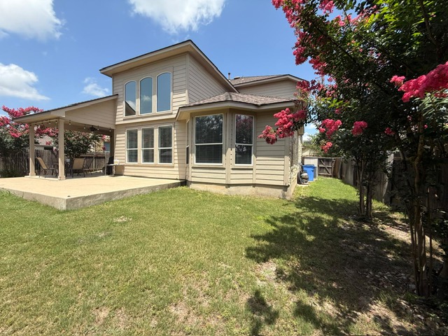 19413 Bridie Path Pflugerville, TX 78660 - Photo 16 of 26 a view of a house with a yard