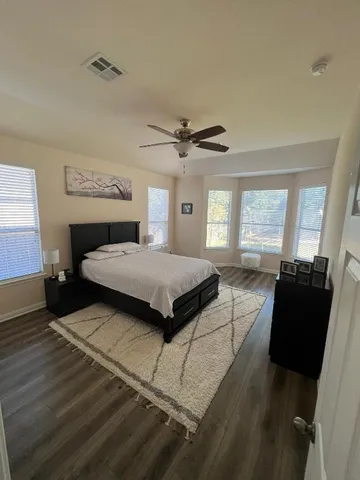 a bedroom with a bed and window