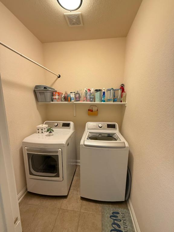 19413 Bridie Path Pflugerville, TX 78660 - Photo 21 of 26 a view of washer and dryer