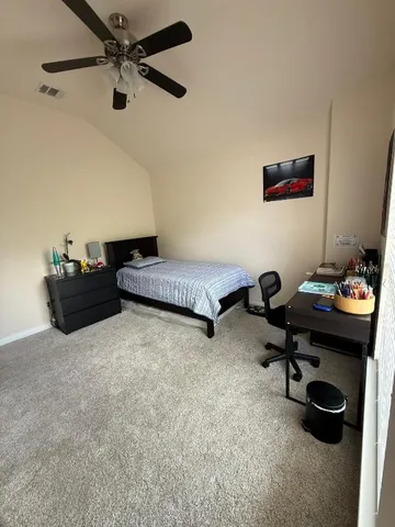 a bedroom with a workspace