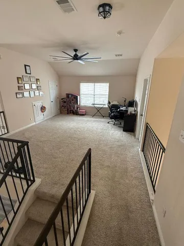 a view of livingroom with furniture and workspace