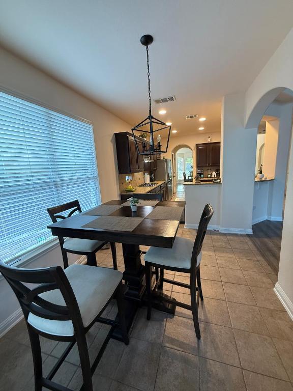 19413 Bridie Path Pflugerville, TX 78660 - Photo 6 of 26 a view of a dining room with furniture