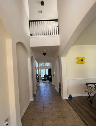 a view of a hallway view with staircase