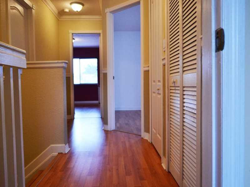 2899 Southwest 129th Terrace, Unit 2899 Miramar, FL 33027 - Photo 9 of 16 a view of a hallway with wooden floor