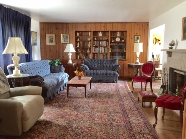 1101 Prospect Road Whitehall, PA 15227 - Photo 2 of 19 Large Living room features log burning fireplace and built in bookcases
