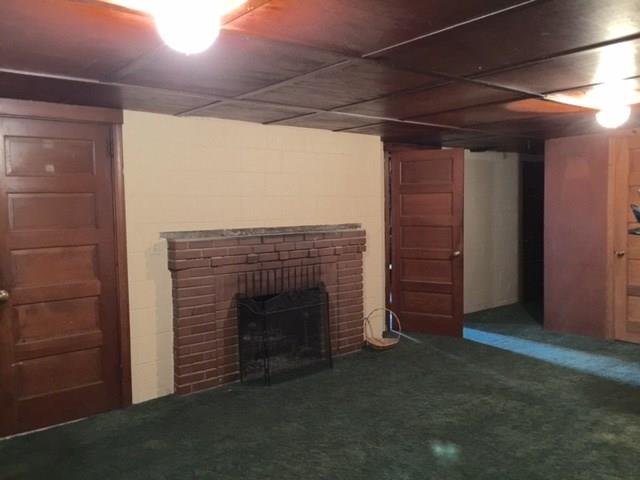 1101 Prospect Road Whitehall, PA 15227 - Photo 11 of 19 Log burning fireplace in the game room on the lower level