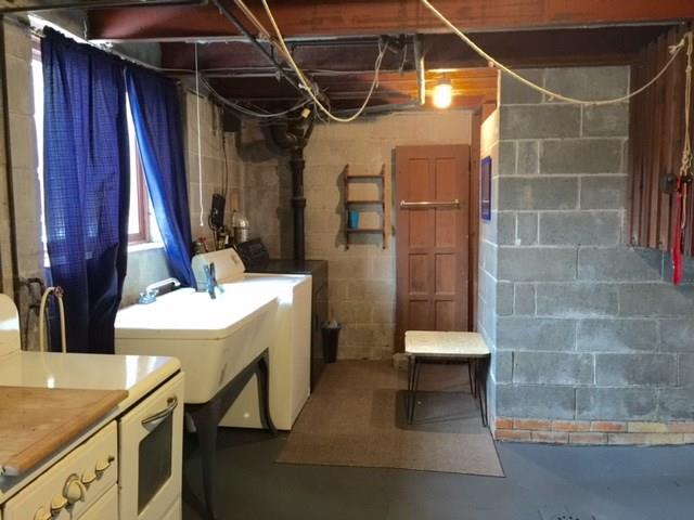 1101 Prospect Road Whitehall, PA 15227 - Photo 13 of 19 Large walk out laundry on lower level with partial bath with shower