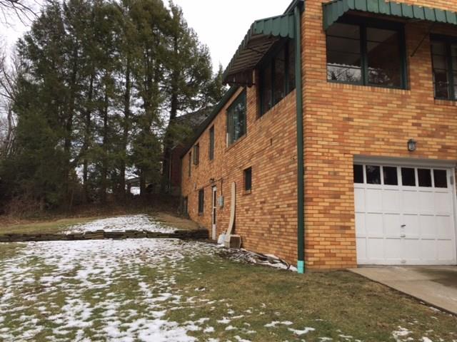 1101 Prospect Road Whitehall, PA 15227 - Photo 18 of 19 Cozy covered porch with awning overlooks nice sized rear yard