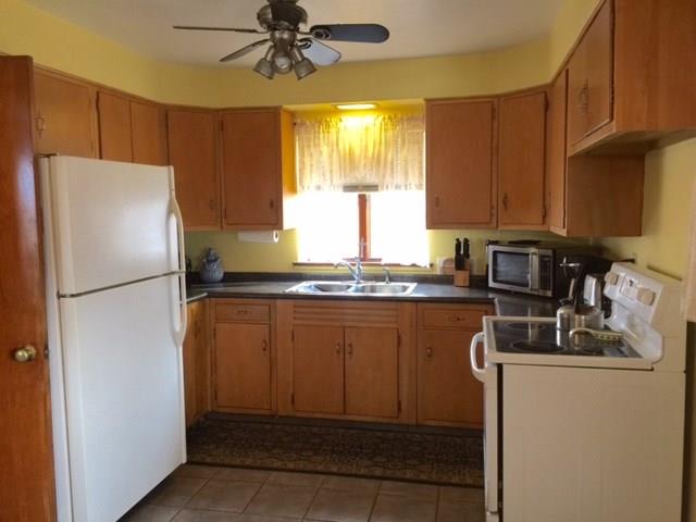 1101 Prospect Road Whitehall, PA 15227 - Photo 4 of 19 Remodeled eat-in-kitchen includes electric stove and refrigerator