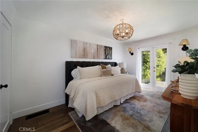 a bedroom with bed and a window