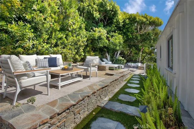 a view of a patio with chairs and a table