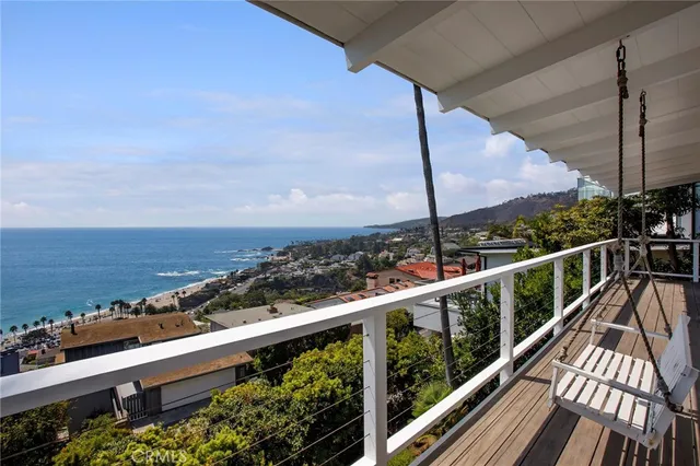 a view of a balcony with an ocean view