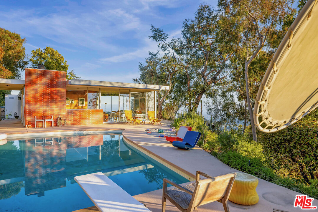 1531 North Tigertail Road Los Angeles, CA 90049 - Photo 10 of 24 swimming pool view with a seating space