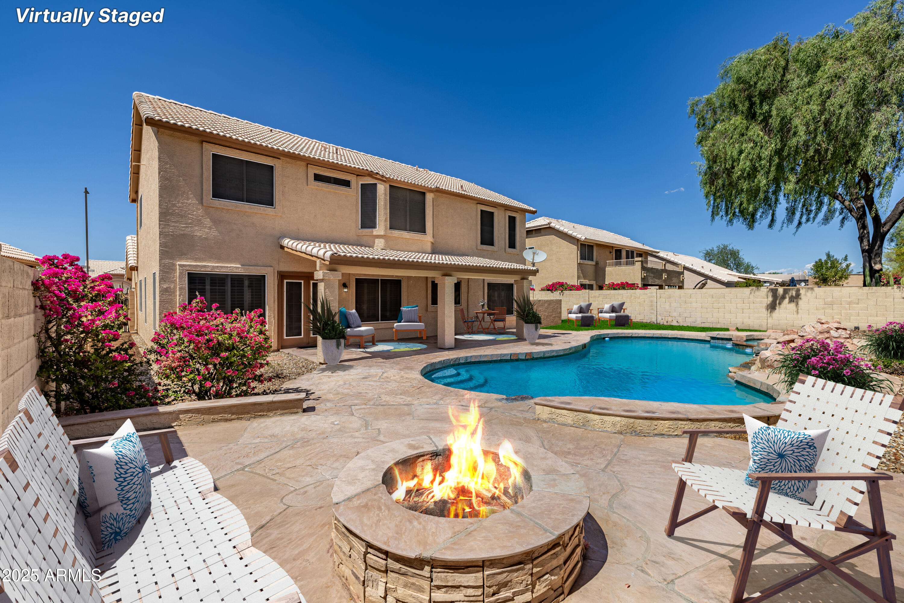 30651 North 44th Street Cave Creek, AZ 85331 - Photo 17 of 18 a view of a house with swimming pool and furniture