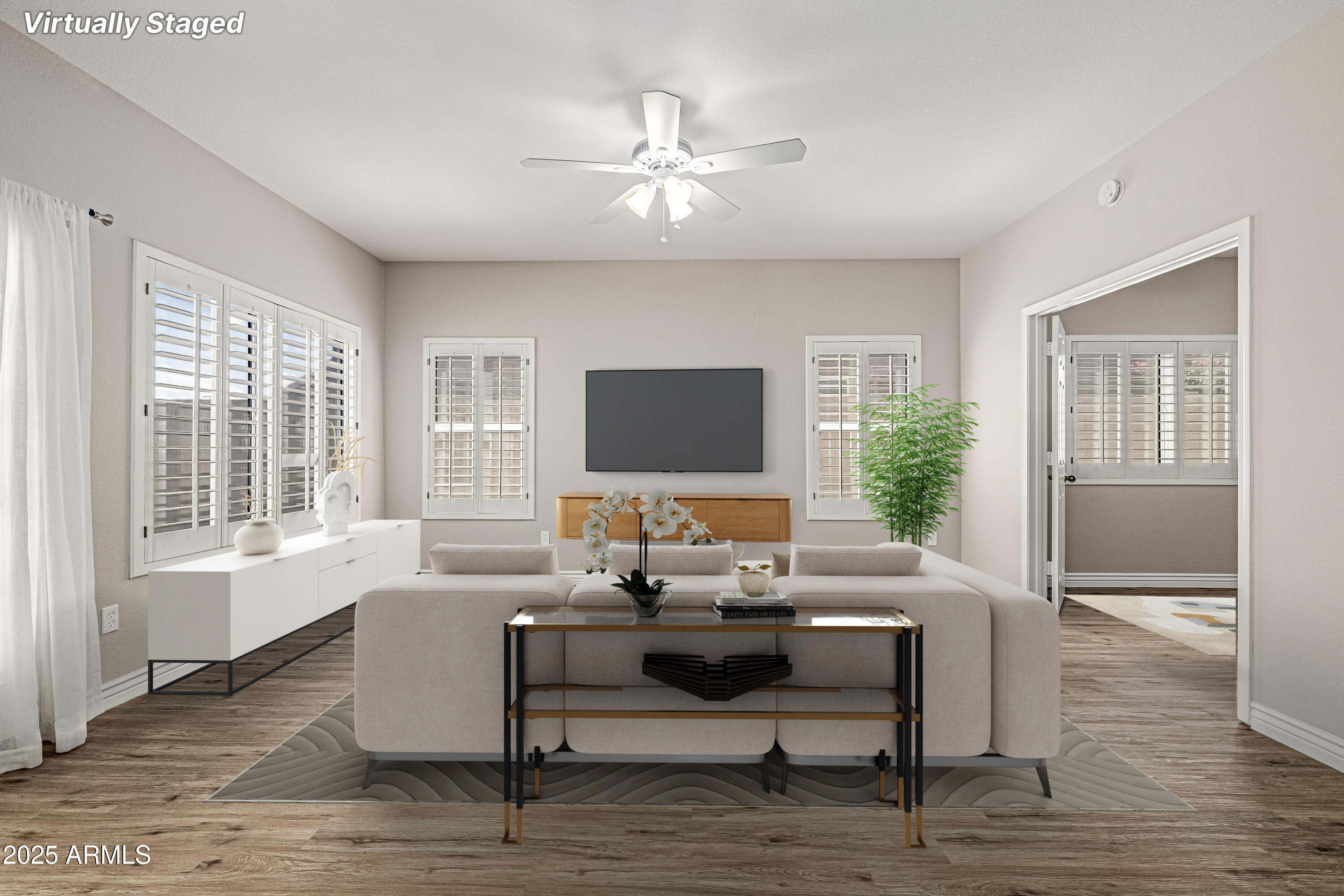 30651 North 44th Street Cave Creek, AZ 85331 - Photo 9 of 18 a living room with furniture and a flat screen tv