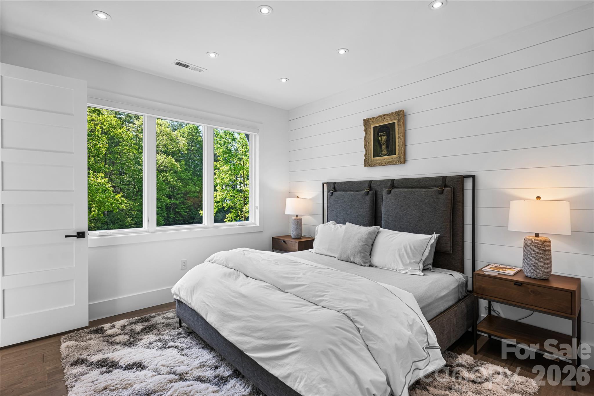 2235 Cold Mountain Road Lake Toxaway, NC 28747 - Photo 31 of 47 a bedroom with a bed and wooden floor