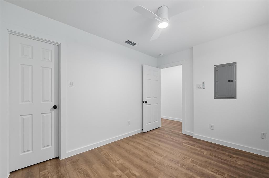 1315 Oneal Street, Unit B Commerce, TX 75428 - Photo 6 of 14 a view of an empty room with wooden floor