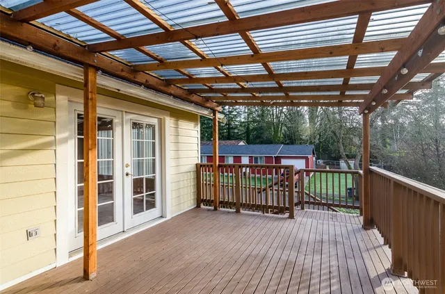 a view of deck with wooden floor and iron stairs
