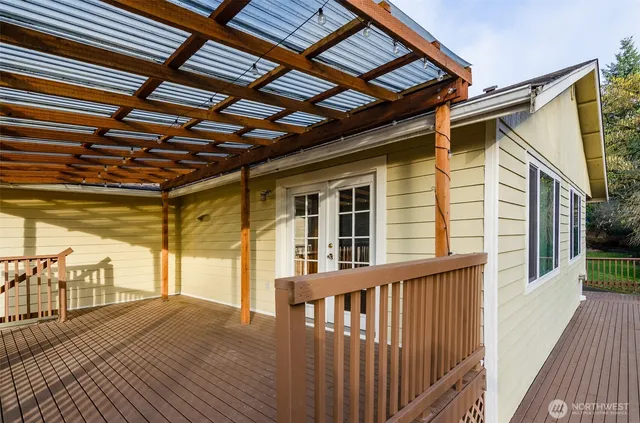 a view of a porch with wooden floor