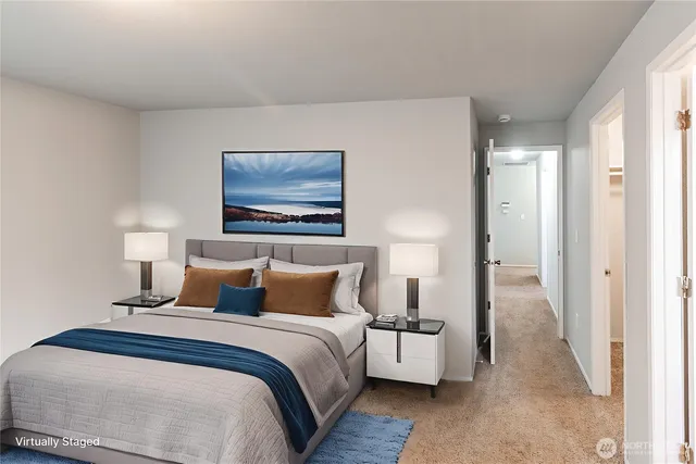 a bedroom with bed and a night lamp