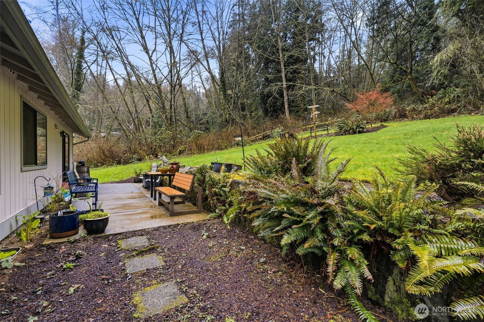 6830 Norma Beach Road Edmonds, WA 98026 - Photo 23 of 30 a view of a backyard with plants and chairs