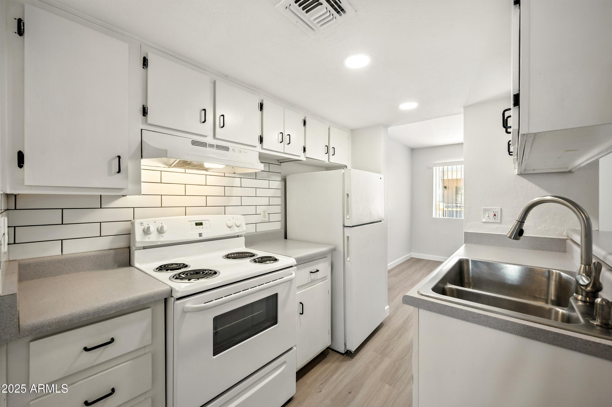 12123 West Bell Road, Unit 221 Surprise, AZ 85378 - Photo 2 of 18 221 Galley Kitchen A