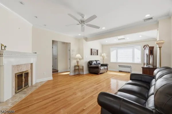 a living room with furniture and fireplace
