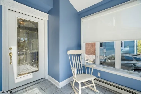 a view of a chair and glass door