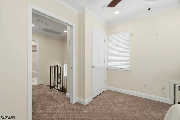 a view of a livingroom with an empty space and a window