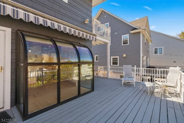 a view of a balcony with wooden floor