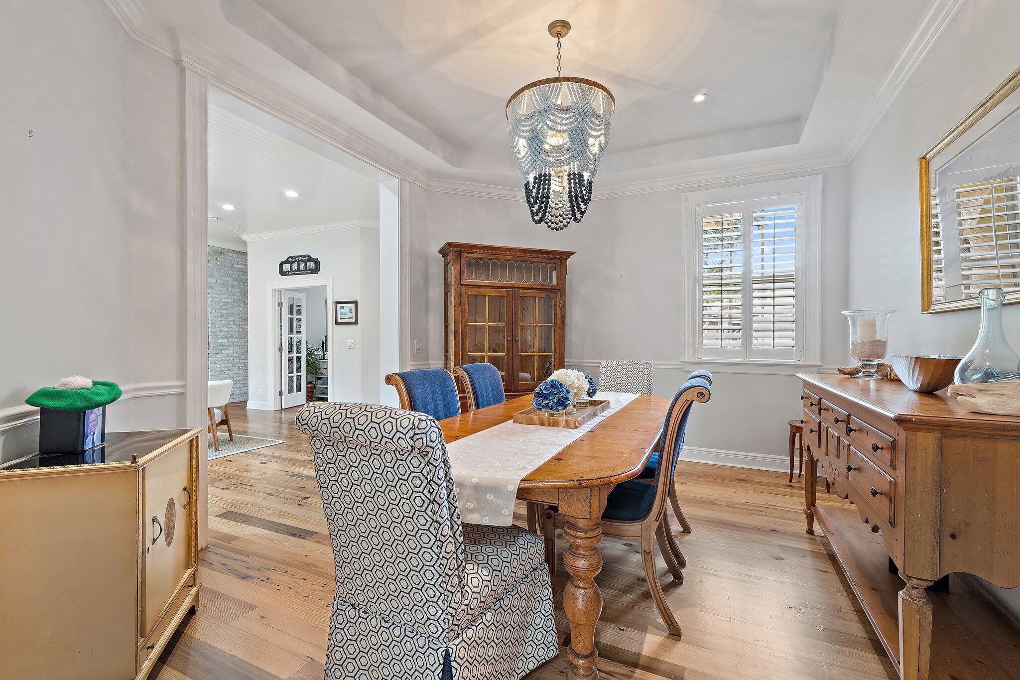 136 Via Catalunha Jupiter, FL 33458 - Photo 15 of 64 a view of a dining room with furniture window and wooden floor