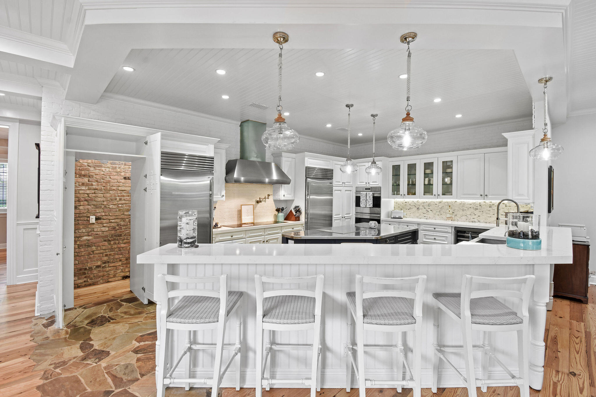 136 Via Catalunha Jupiter, FL 33458 - Photo 24 of 64 a large kitchen with a table and chairs