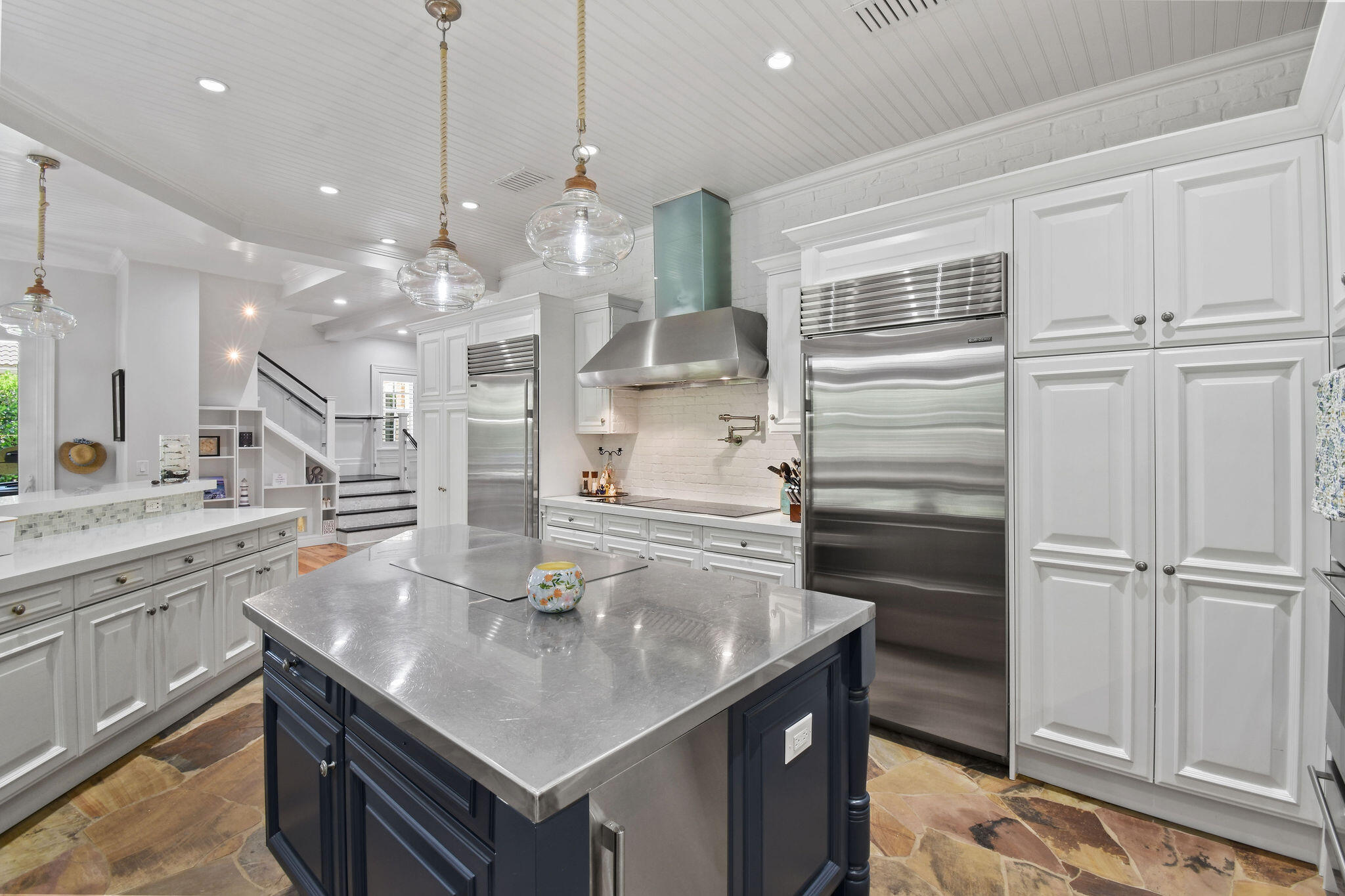136 Via Catalunha Jupiter, FL 33458 - Photo 25 of 64 a kitchen with stainless steel appliances granite countertop a sink a stove and a refrigerator