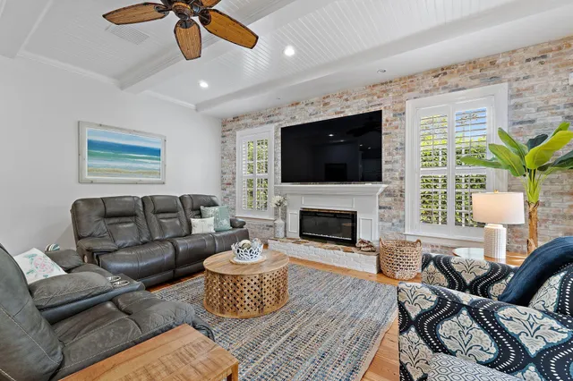 a bathroom with a sink a large mirror and a shower