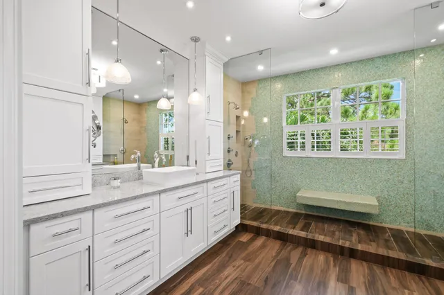 a bathroom with a bathtub and shower