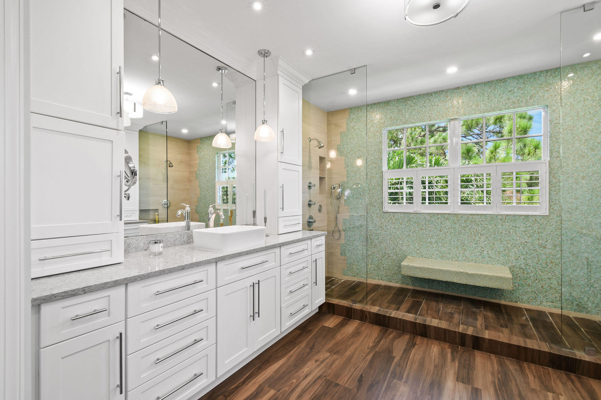 136 Via Catalunha Jupiter, FL 33458 - Photo 33 of 64 a bathroom with a double vanity sink and a mirror