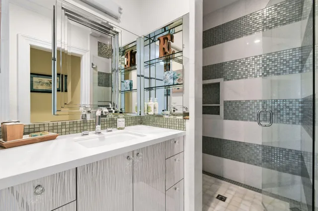 a view of a patio with a dining table and chairs with wooden floor